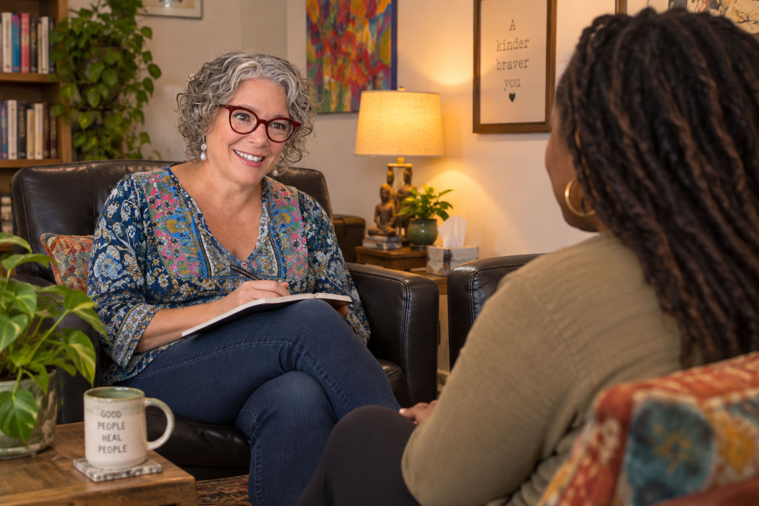 Cheryl in her office, listening to a client