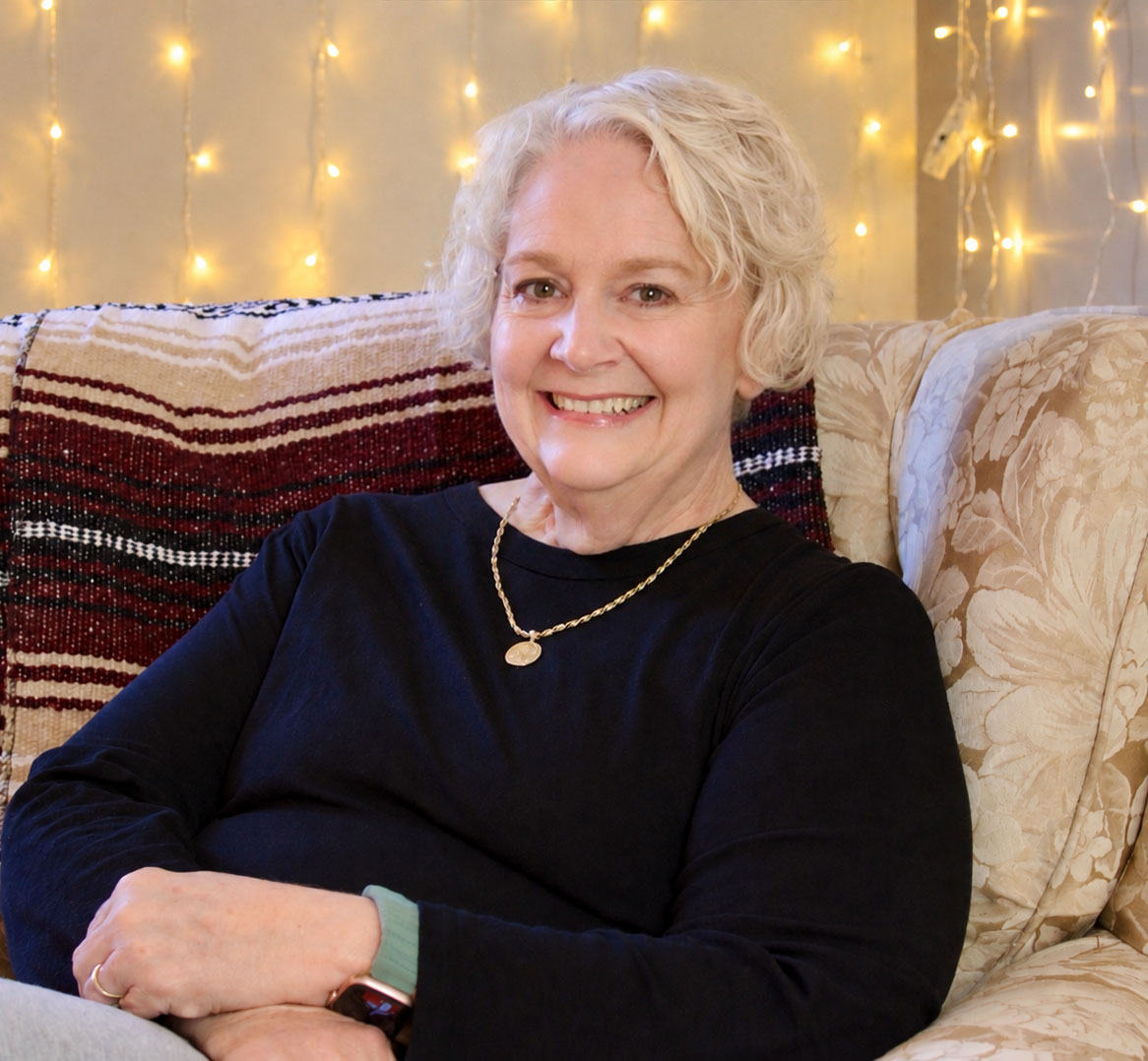 Susan Fiegl, relaxing on the sofa in her office
